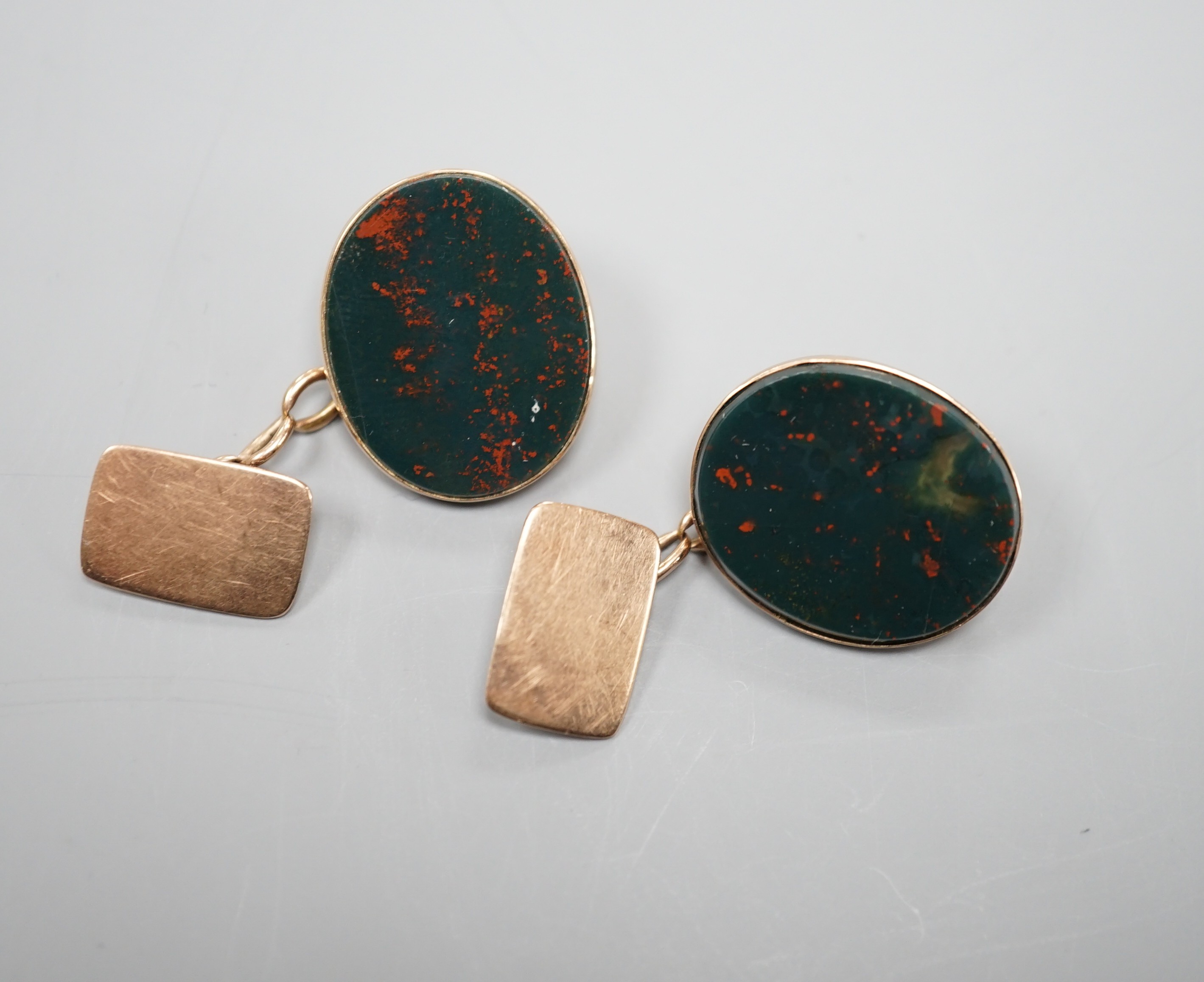 A pair of 9ct and oval bloodstone set cufflinks, 22mm, gross weight 10.4 grams.